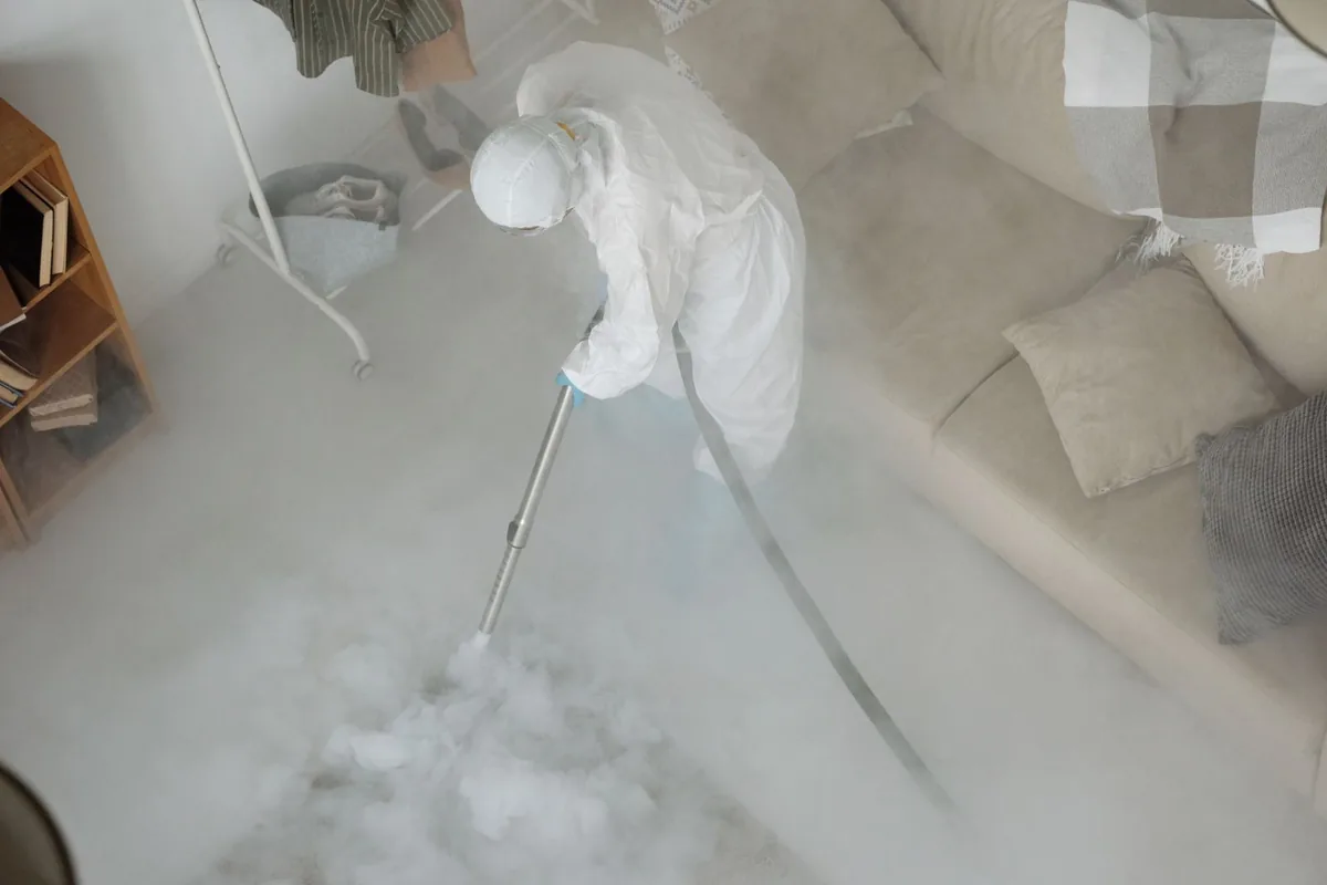 Biohazard cleanup technician in protective equipment, Sultan, WA